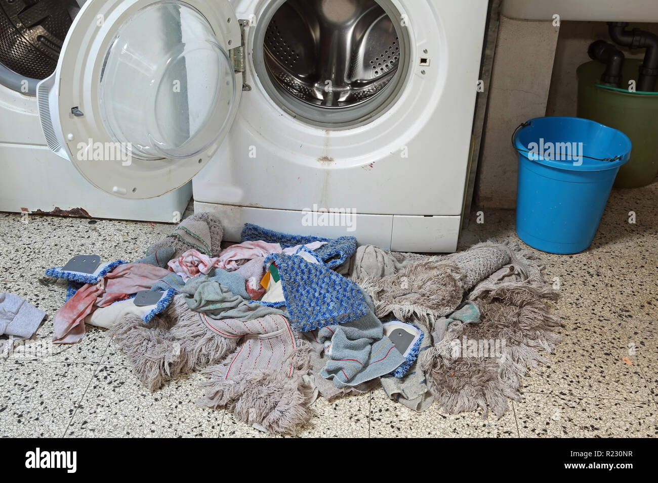 very old washing machine and many dirty rags Stock Photo - Alamy