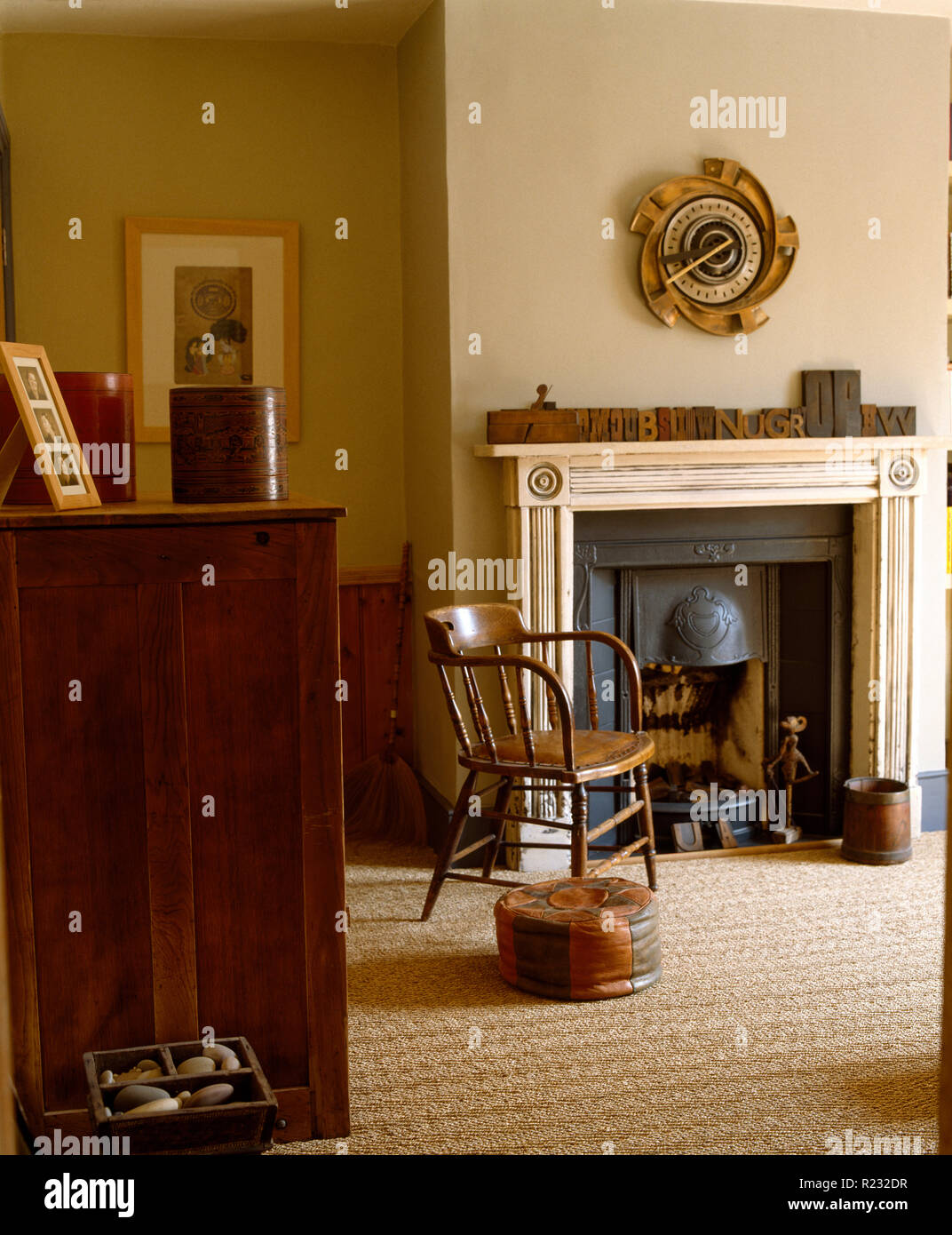 Antique chair beside fireplace in masculine bedroom Stock Photo Alamy