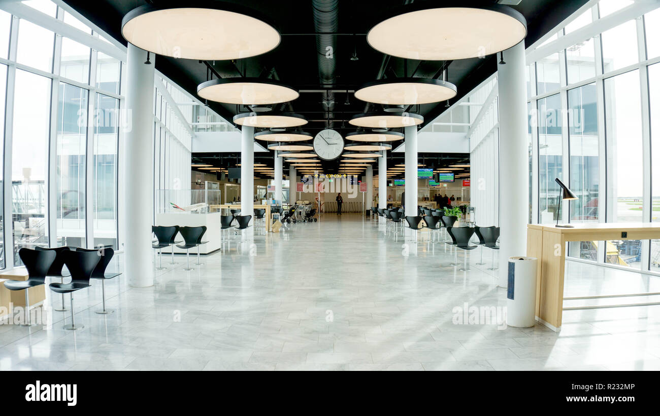 COPENHAGEN, Denmark - OCTOBER 8, 2018. Beautiful Emirates Airlines terminal of the International airport. Wide space with a lot of light and confortable empty spaces, Modern minimalist decoration Stock Photo