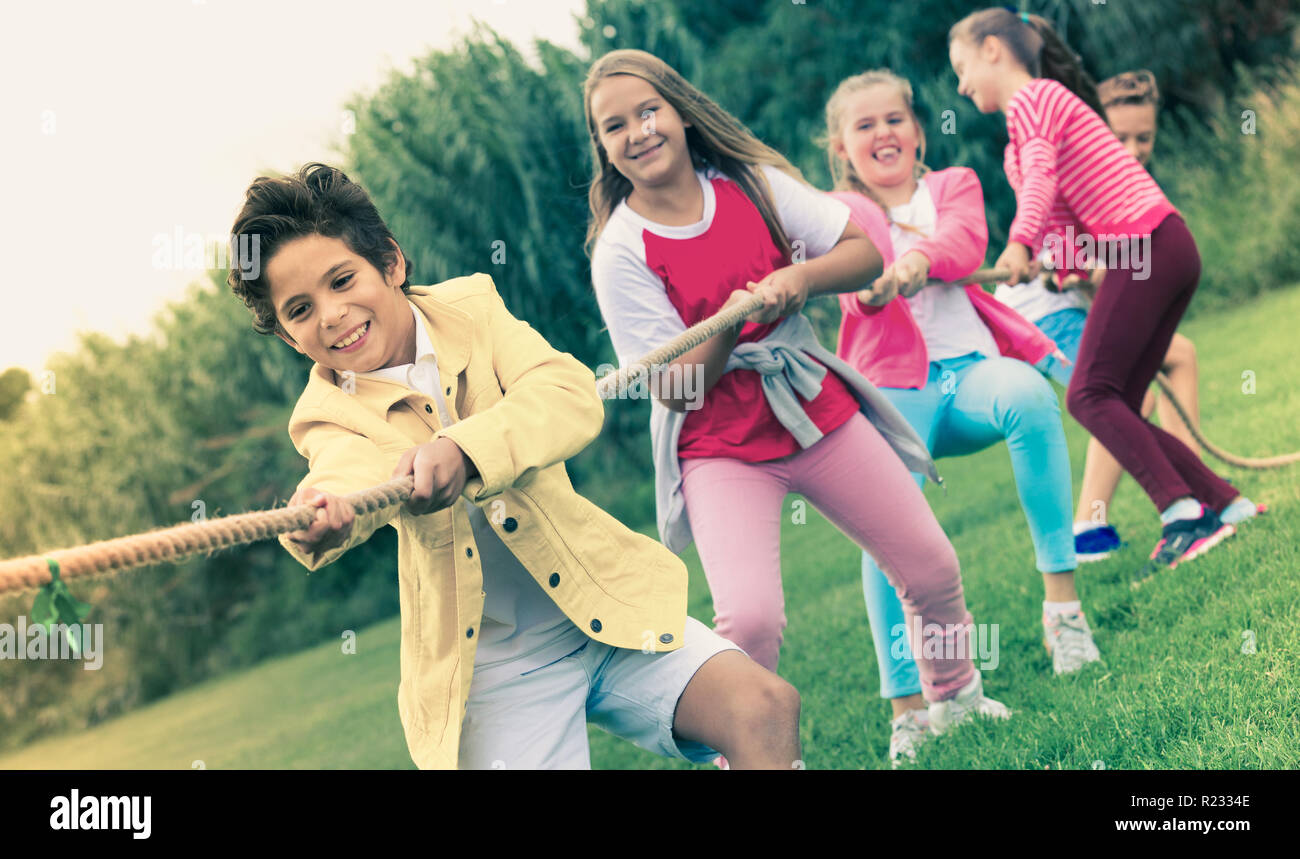 Portrait girl boy pulling rope hi-res stock photography and images - Alamy