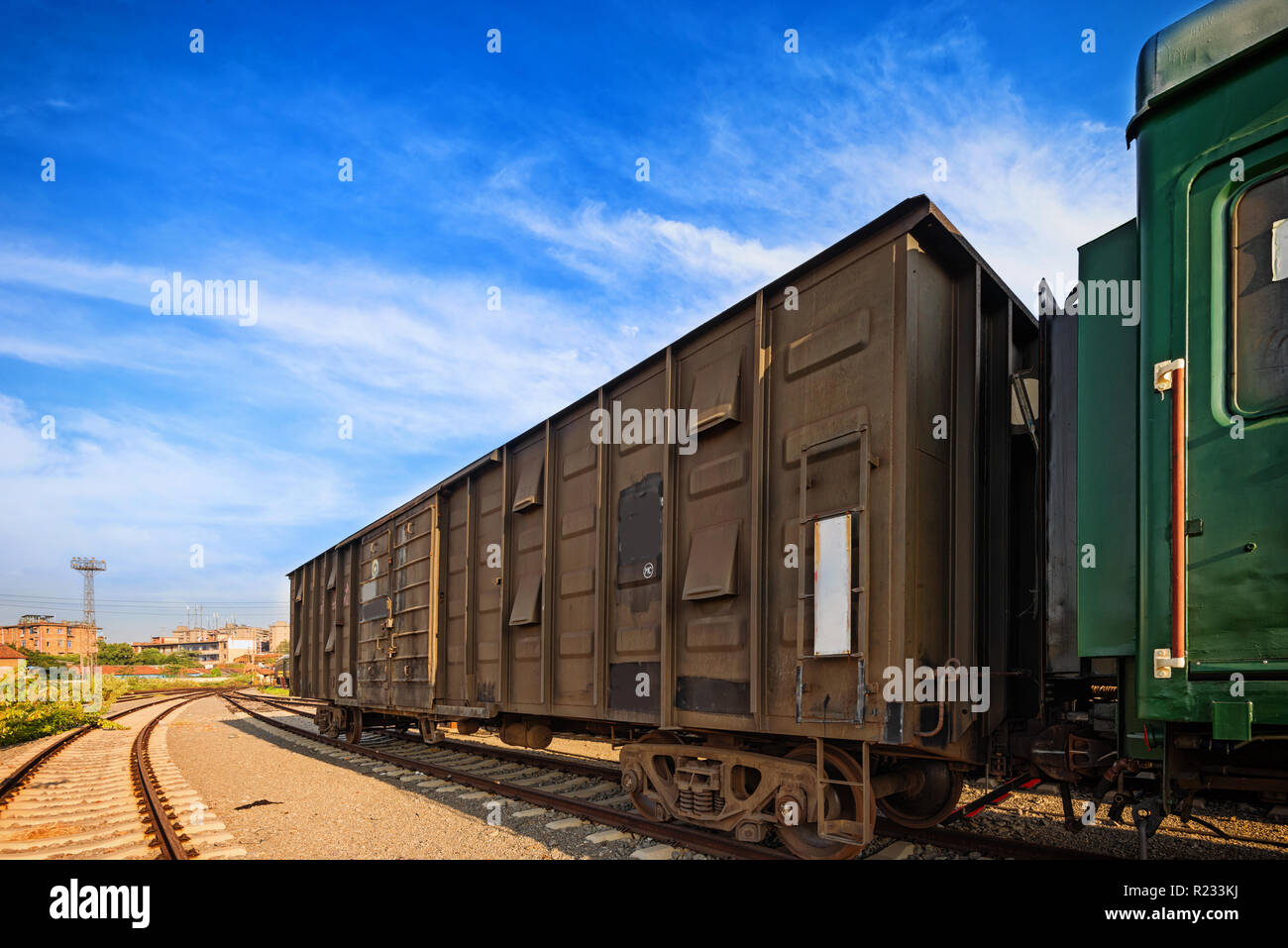 Cargo train platform at sunset with container Stock Photo - Alamy
