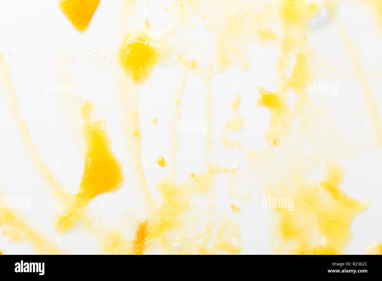 Yellow jam drops on macro. Abstract background of jam. Stock Photo
