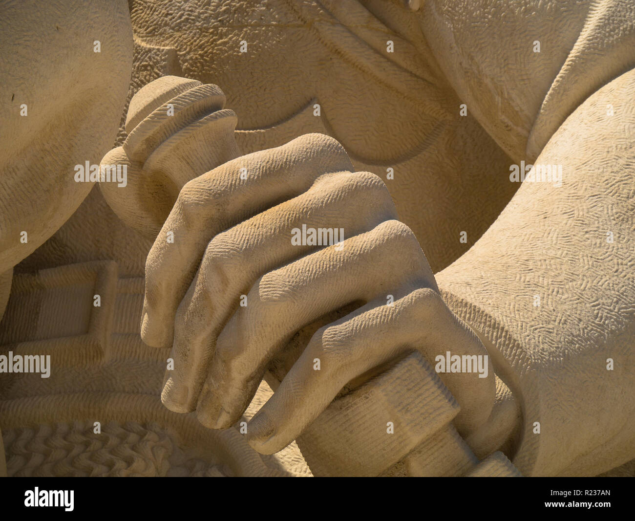 detail of a hand on sword carving, Monument to the Discoveries (Padrão dos Descobrimentos) Lisbon,Portugal,Europe Stock Photo