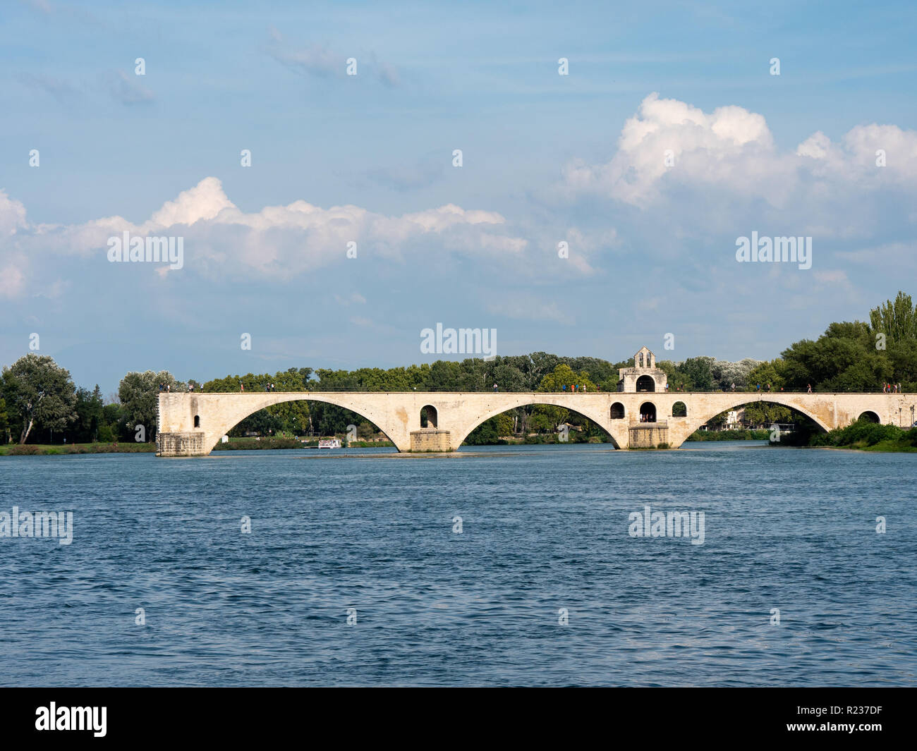 View on the Rhone river in Avignon, southern France. The river is crossed by a famous medieval bridge called the 'Pont d'Avignon' or 'Pont Saint-Bénéz Stock Photo