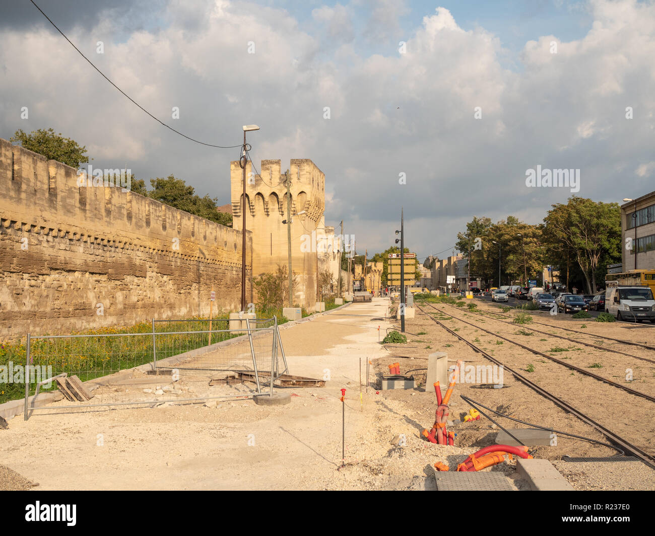 View on the walls of the wall of the city of Avignon. Construction of a tram in the city. France. Stock Photo