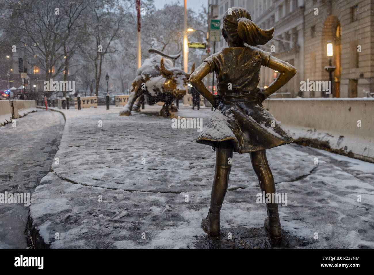 New York, United States. 15th Nov, 2018. Fearless Girl statue covered in snow as New York City was hit by the first snow of the season on November 15, 2018 around noon, bringing a hodge-podge wintry conditions. The city's emergency management service advised New Yorkers to be aware of slippery conditions, also issued a travel advisory for Thursday particularly during the evening commute. Credit: Erik McGregor/Pacific Press/Alamy Live News Stock Photo
