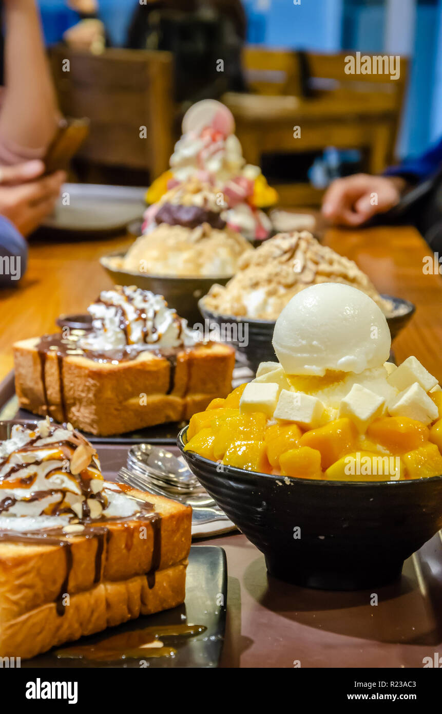 Desserts on a table at a dessert cafe in Seoul, South Korea Stock Photo