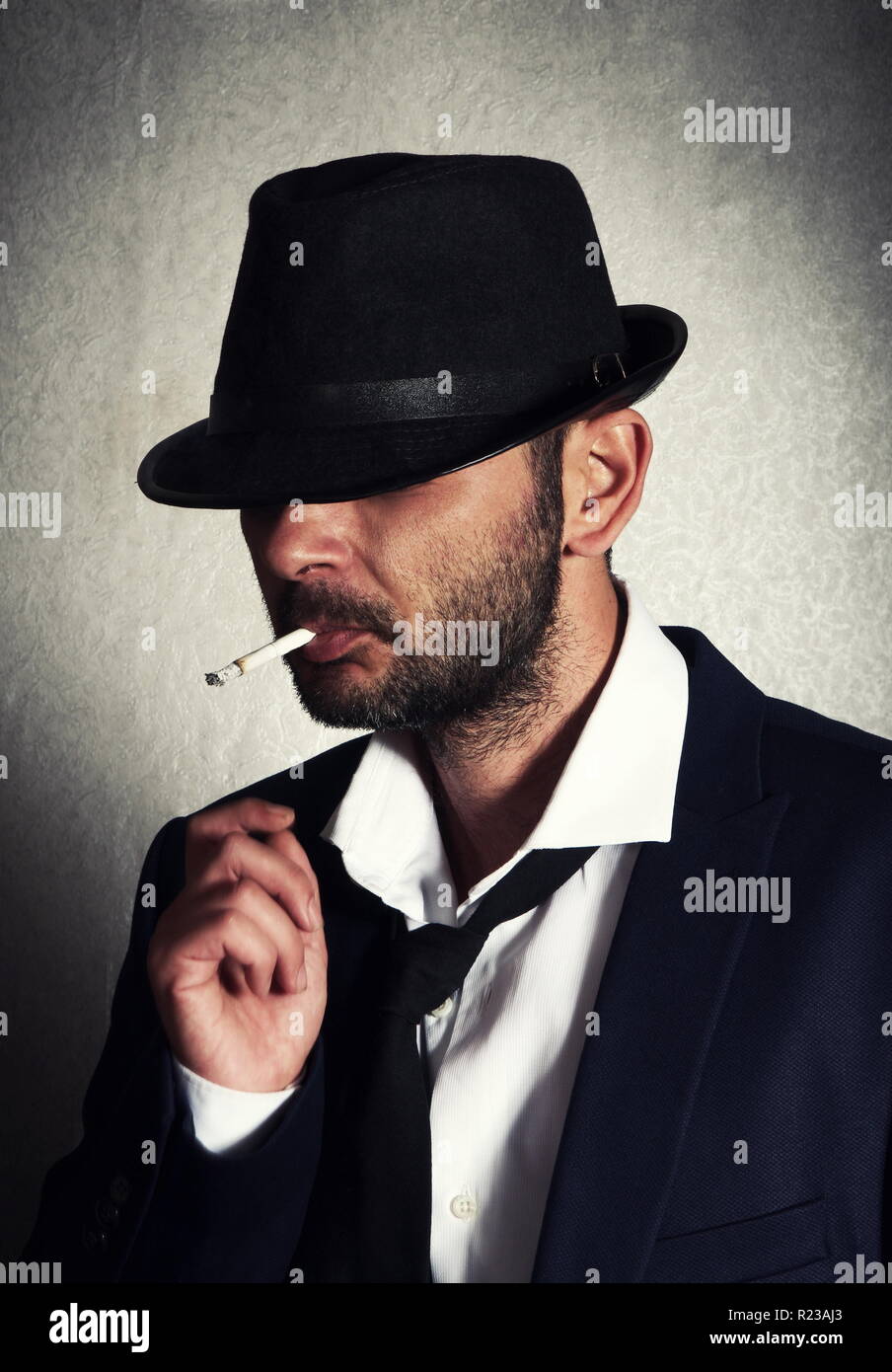 Retro man with the hat and cigarette Stock Photo