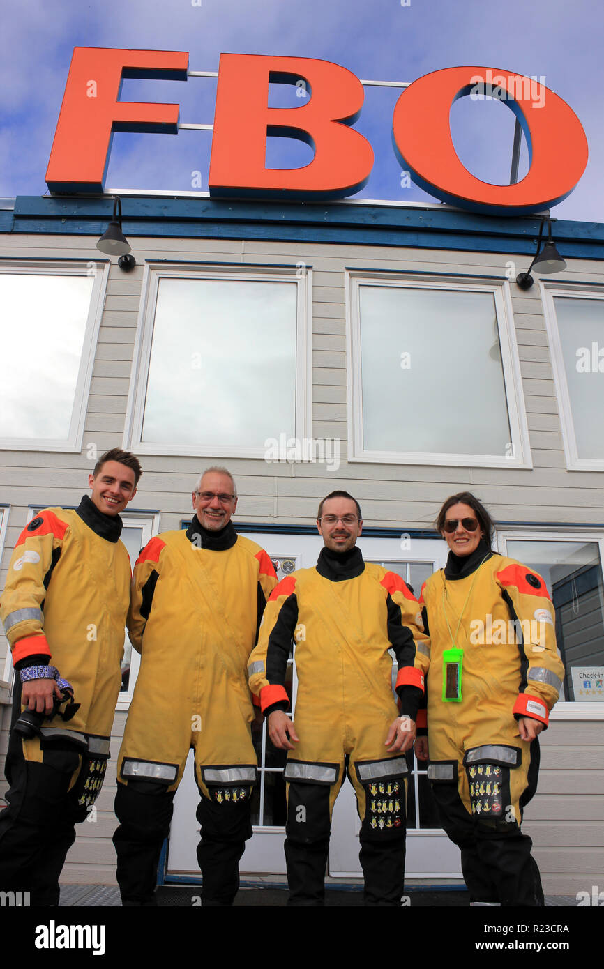 Scientists from ArcticNet & Horizon 2020 Funded ATLAS program wearing sea survival suits at FBO office prior to helicopter transfer to CCGS Amundsen Stock Photo