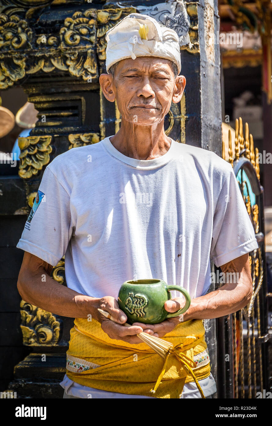 BALI, INDONESIA - APRIL 25, 2018: Portrait of a balinese senior man in front of his house, Indonesia Stock Photo
