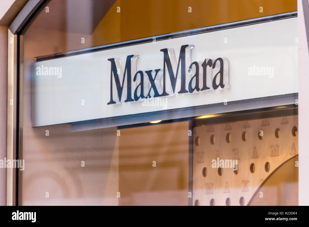 RAVENNA, ITALY - SEPTEMBER 12, 2018: light is enlightening MaxMara logo on storefront Stock Photo