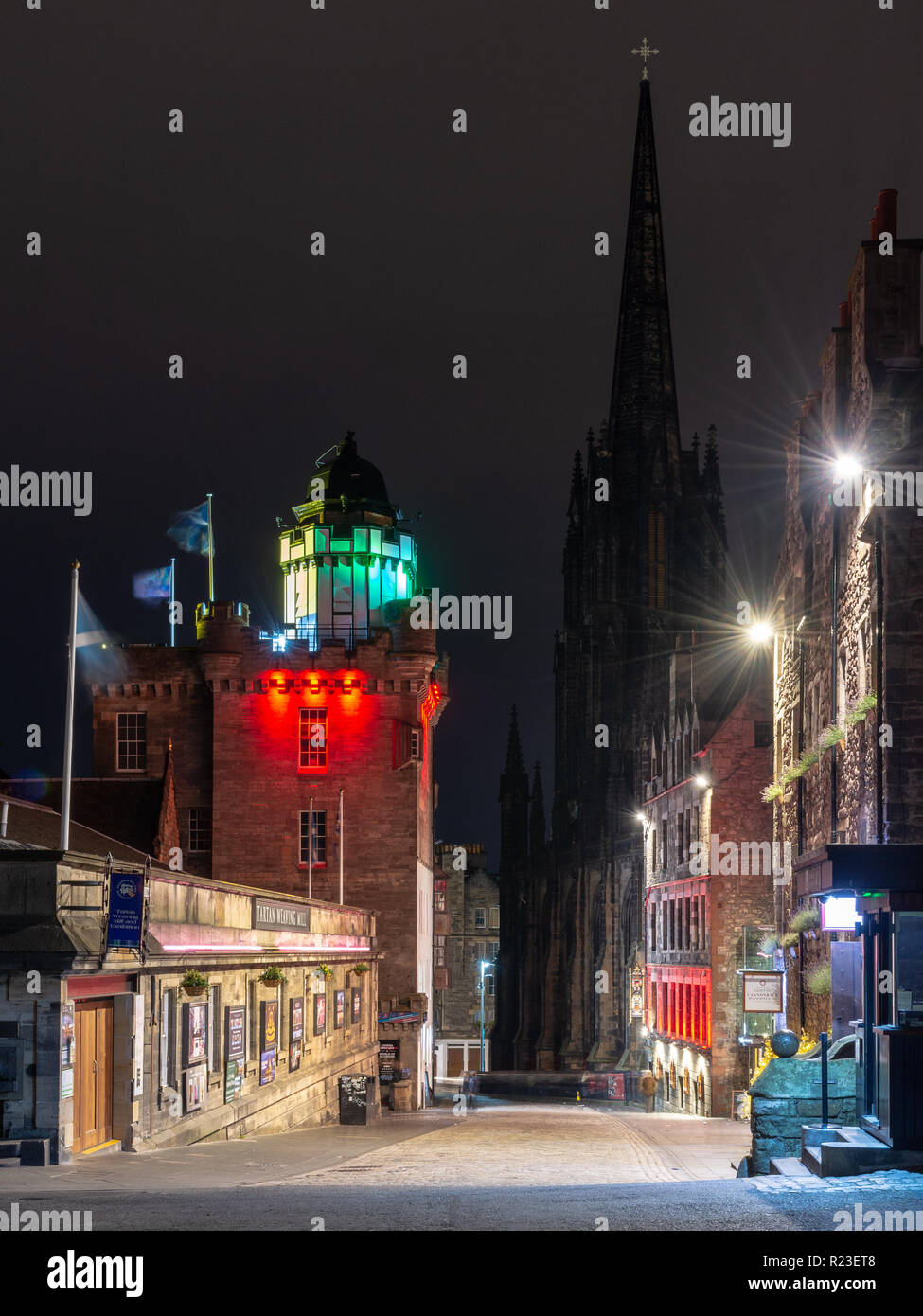 Edinburgh, Scotland, UK - November 2, 2018: The Camera Obscura building is lit at night opposite Tolbooth Kirk on Castle Hill at the head of the Royal Stock Photo