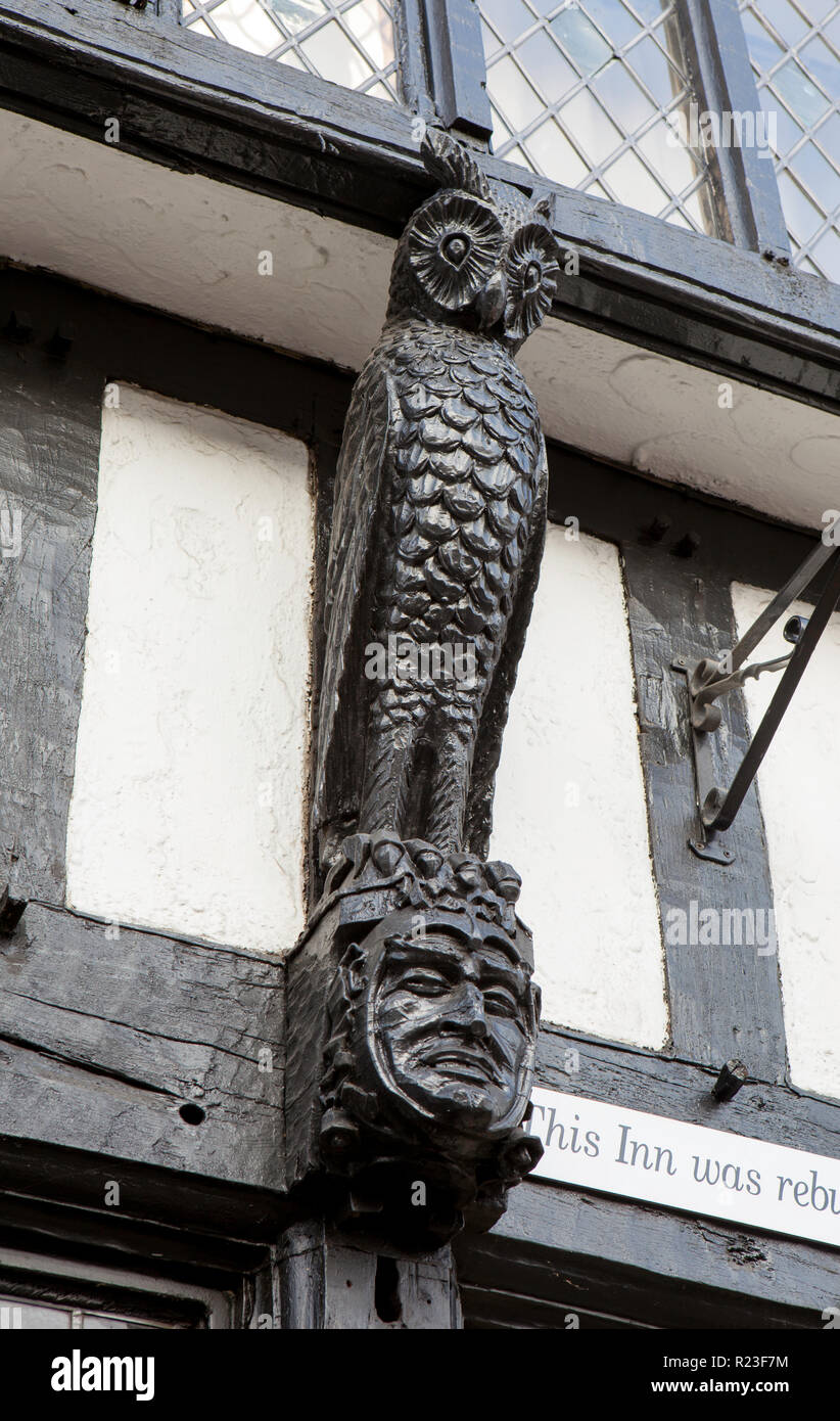Close up of a wooden owl sculpture on the frontage of The Old Ship Inn, a pub in Brighouse, West Yorkshire Stock Photo
