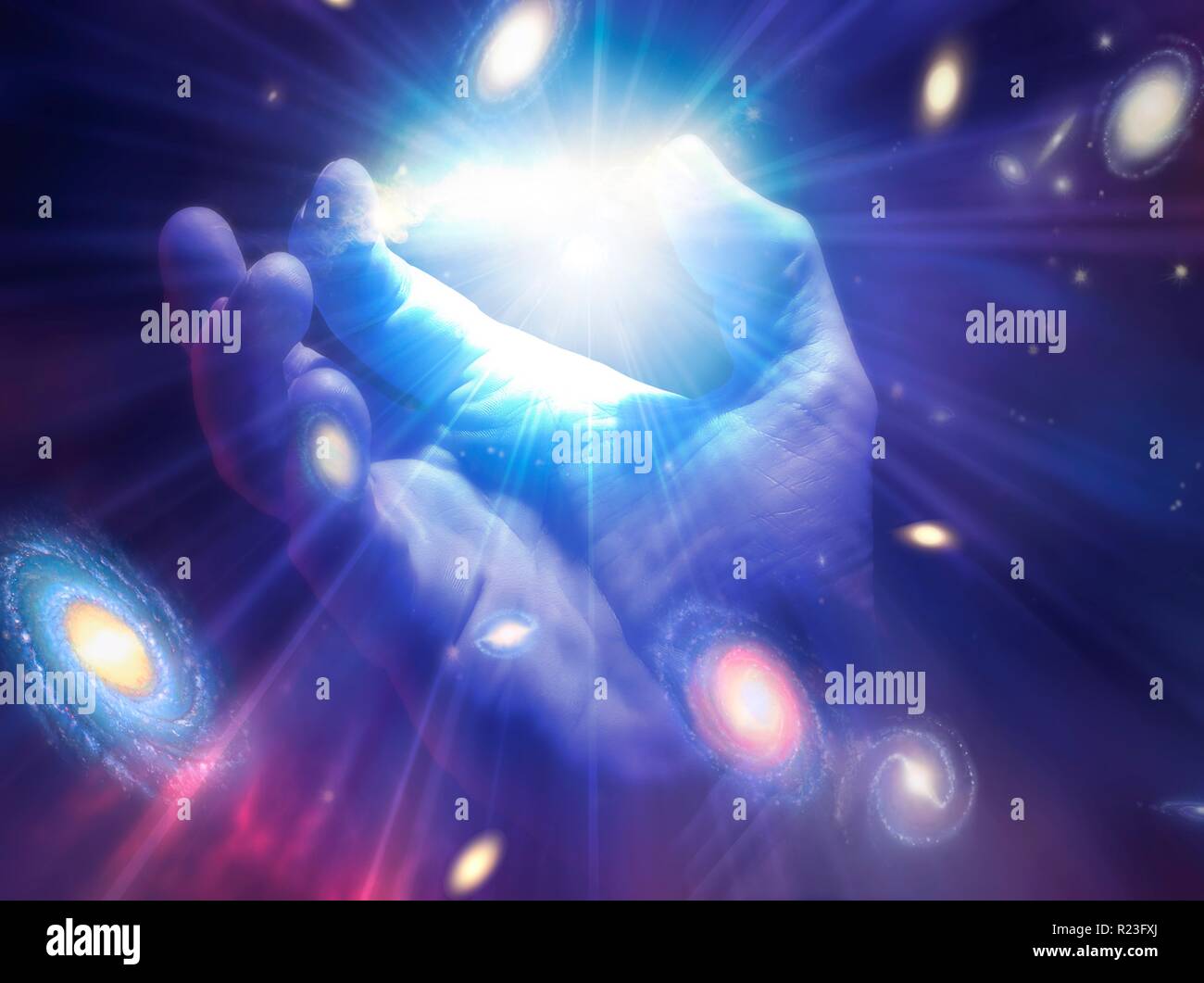 Conceptual illustration of creation. A hand is shown with light rays and galaxies emanating from it. Stock Photo