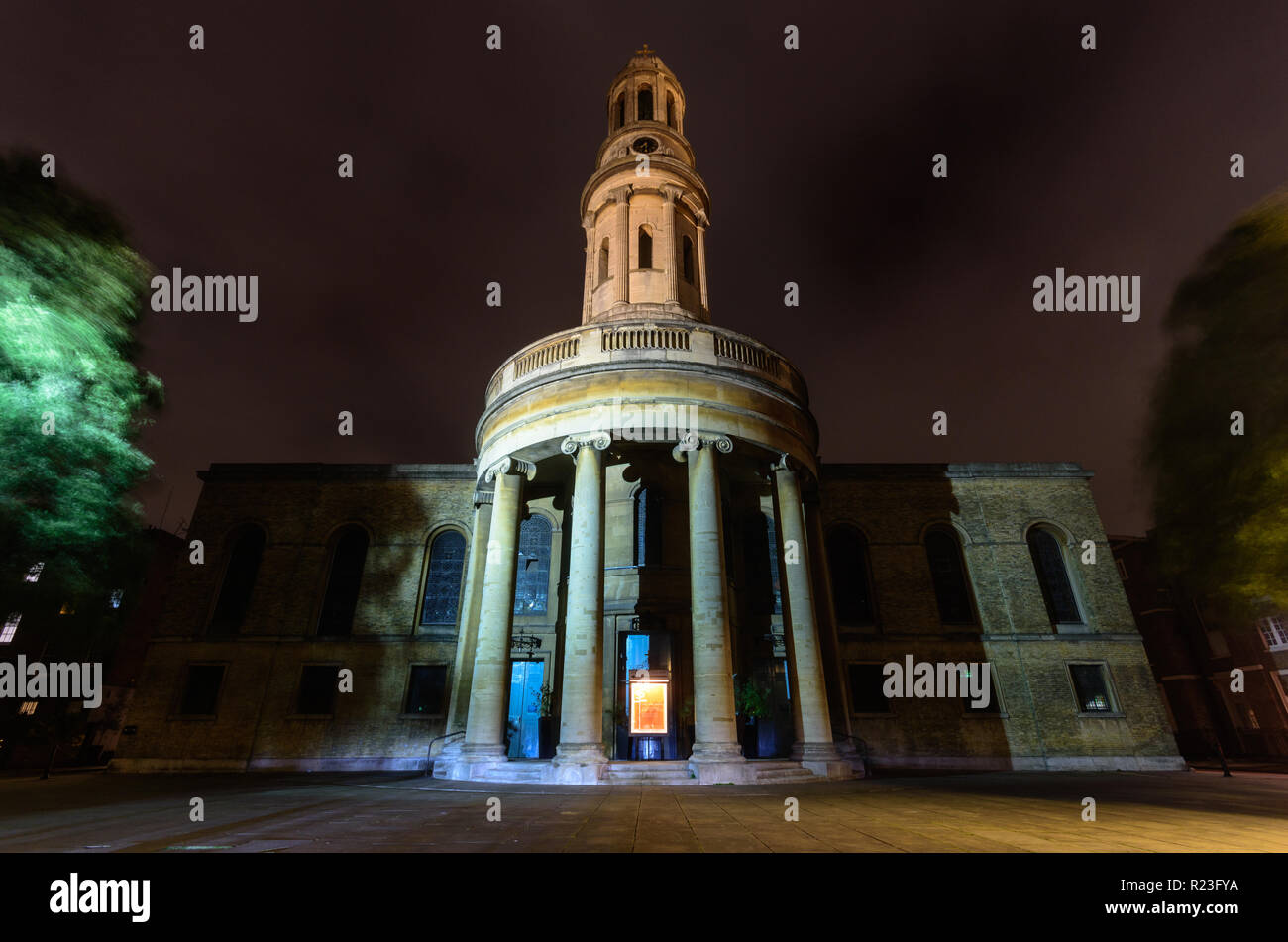 London, England, UK - October 12, 2018: The tower and south face of St Mary's Church is lit at night in Bryanston Square in the Marylebone neighbourho Stock Photo