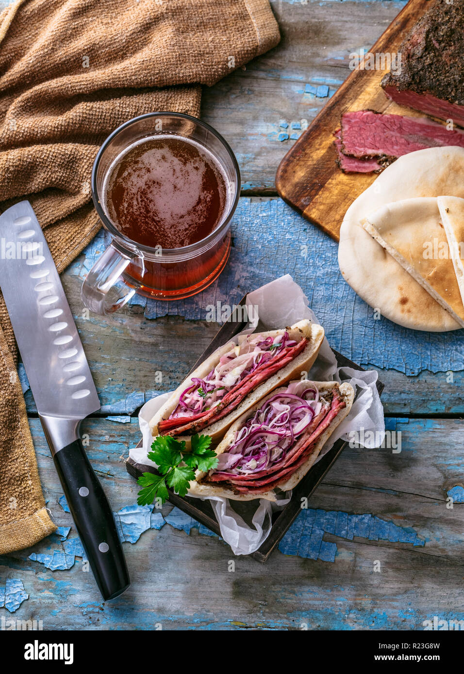 Delicious pastrami club sandwich and pickles Stock Photo Alamy