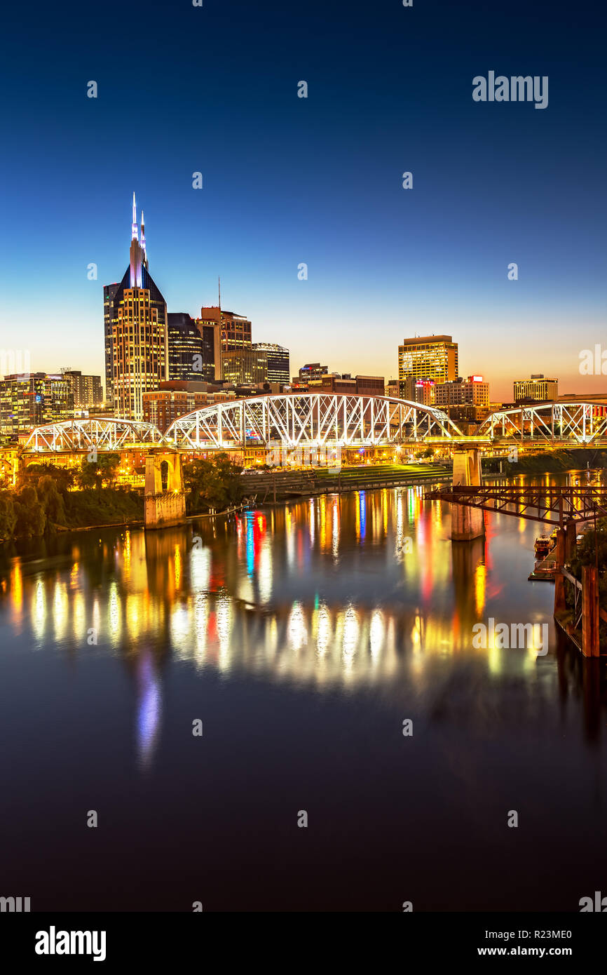 Nashville Skyline and John Seigenthaler Pedestrian Bridge at Dusk Stock Photo