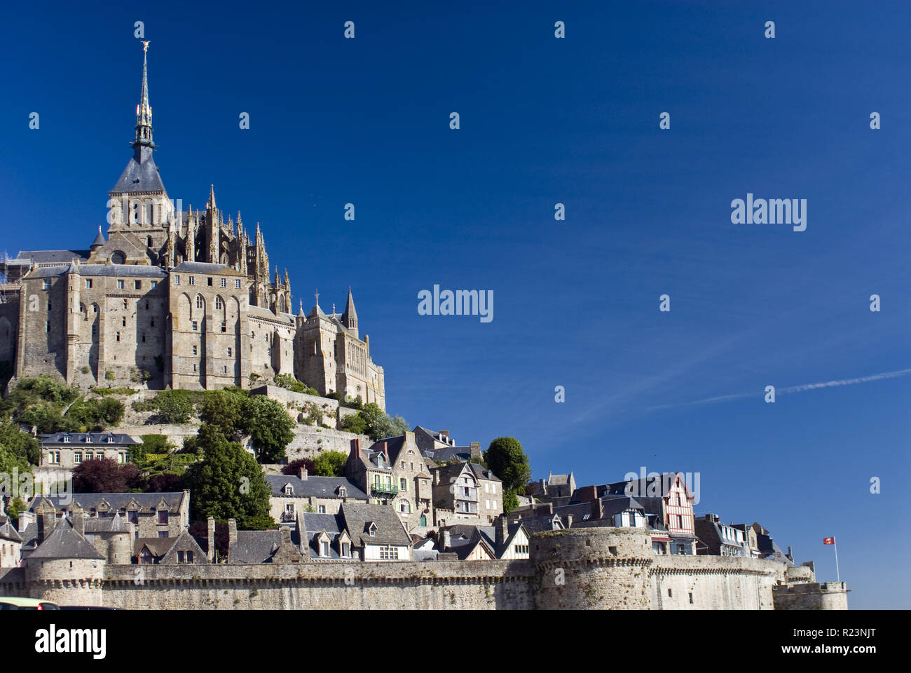 Mont-Saint-Michel (Le Mont-Saint-Michel) is an island commune in Normandy, France known for its monastery and fortifications. Stock Photo