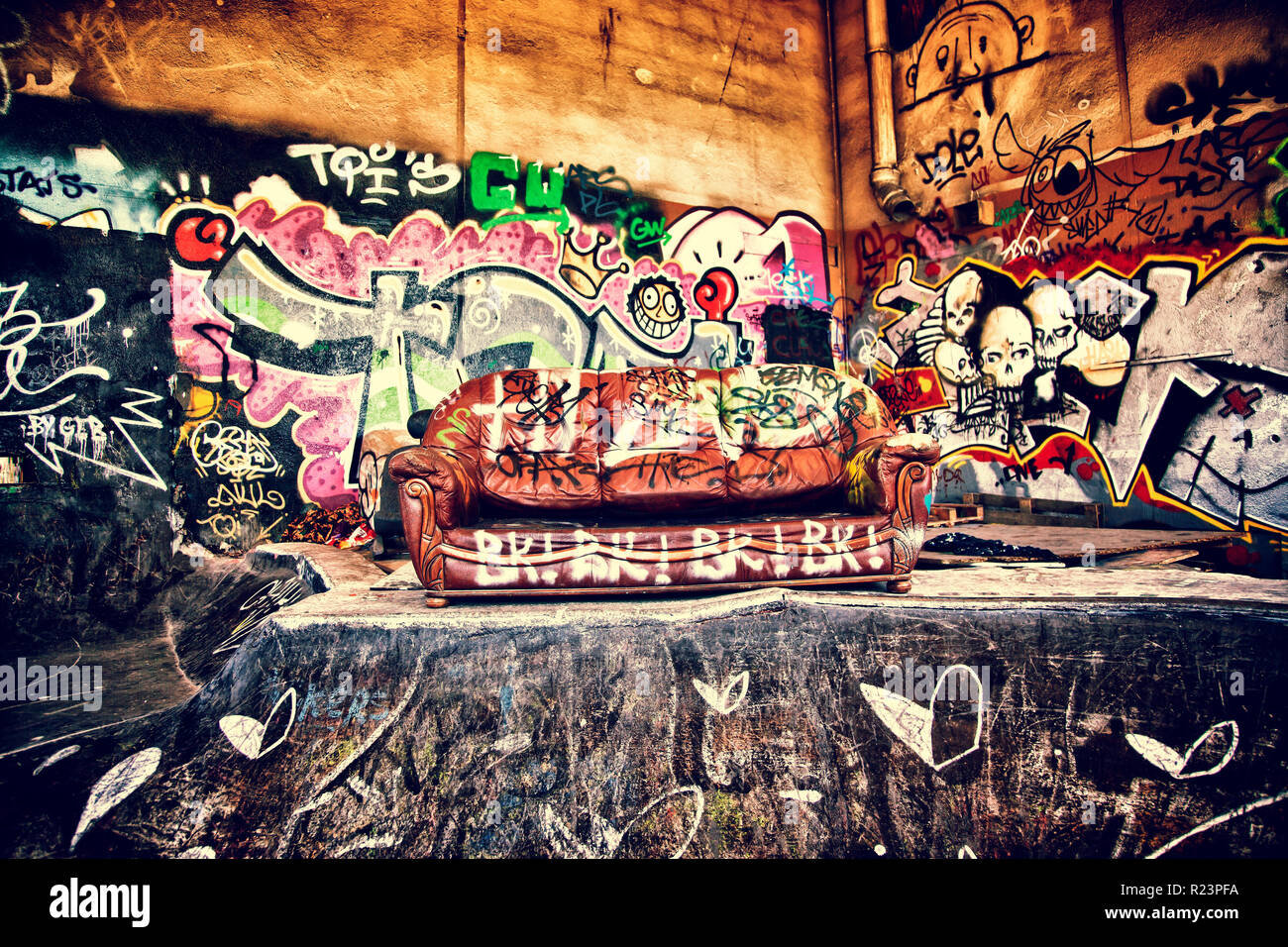 Sofa in a disused warehouse Stock Photo