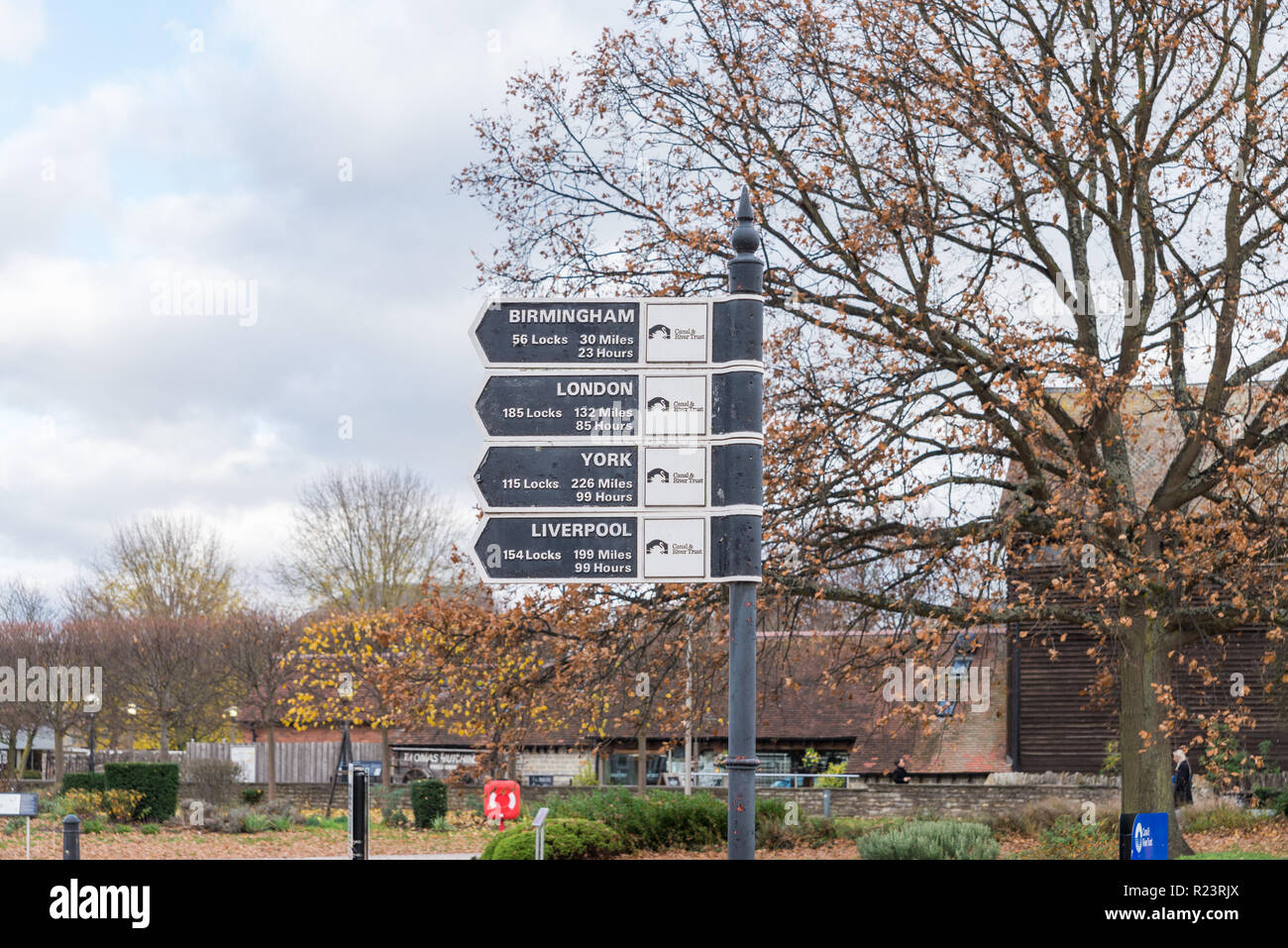 Canal and River Trust signs by the canal in Stratford-upon-Avon, Warwickshire showing distances to cities Birmingham,London,York and Liverpool Stock Photo