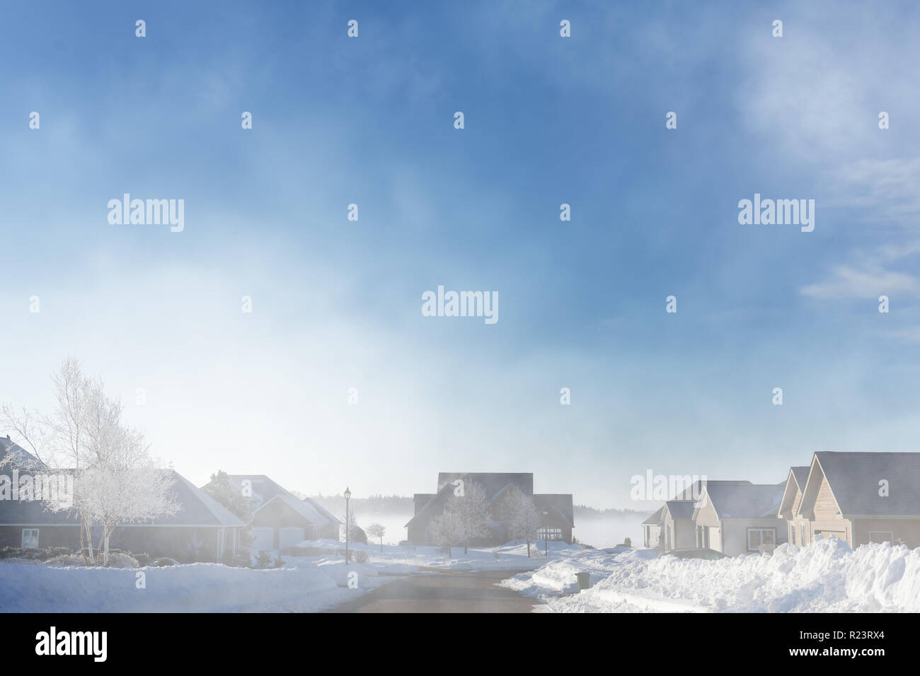 Fog rising over a North American suburb. Stock Photo
