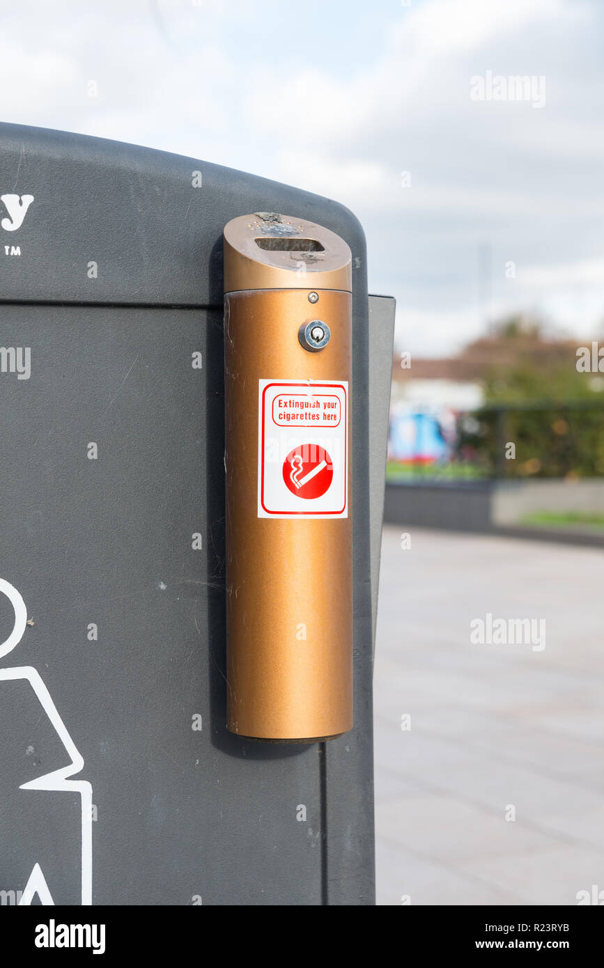 Gold ashtray for cigarette ends attached to an outdoor bin in Stratford-upon-Avon, Warwickshire Stock Photo