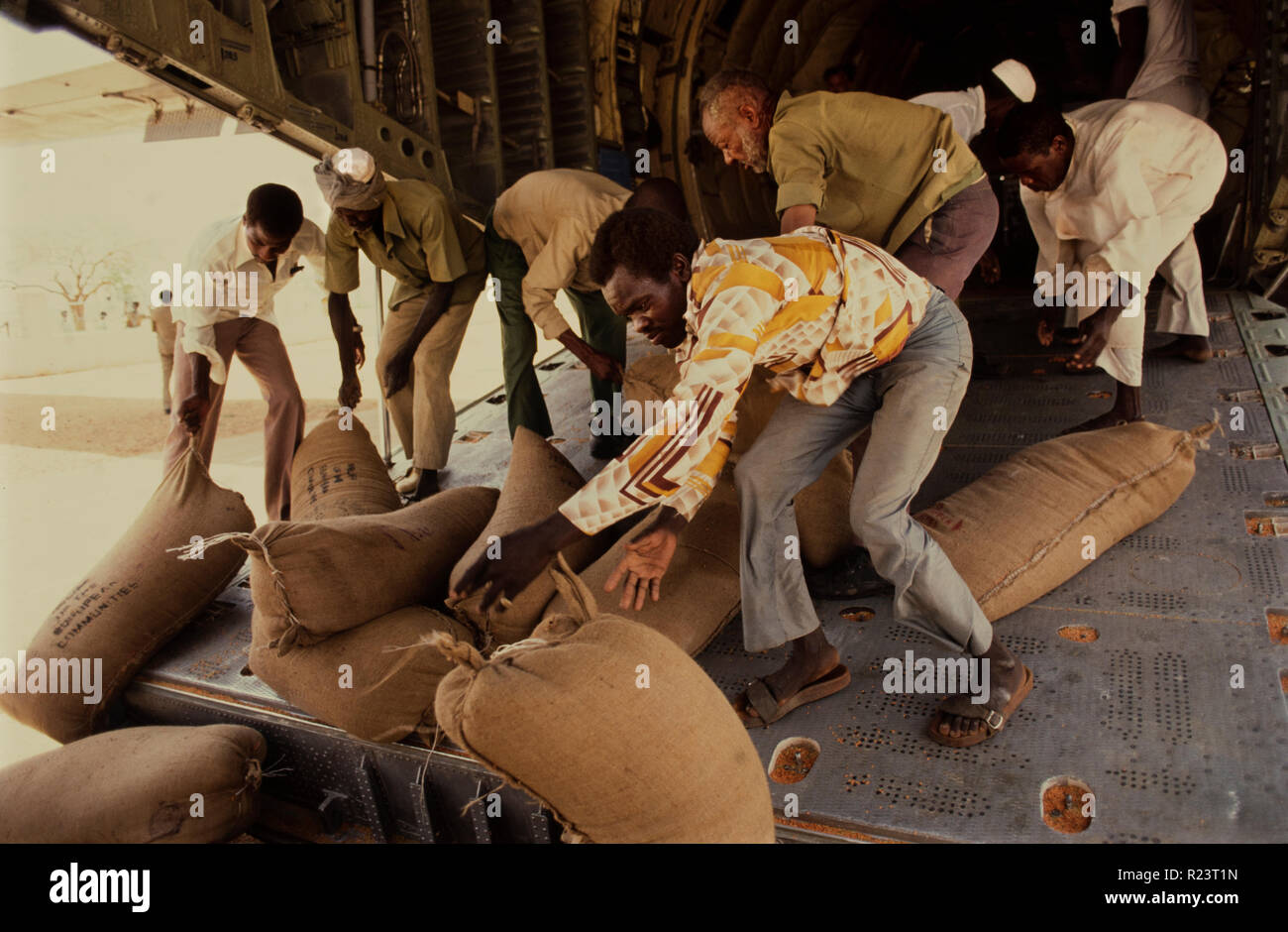 Sudan during the famine period of May-June 1985. This picture scanned in 2018.American Food aid arrives on a German Airforce C120 plane. Stock Photo