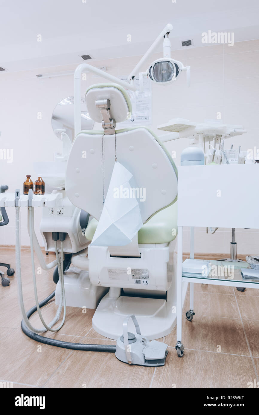 Interior of professionally equipped and modern design small dental office.  Dental chair and other accessories used by dentists. White tone Stock Photo  - Alamy