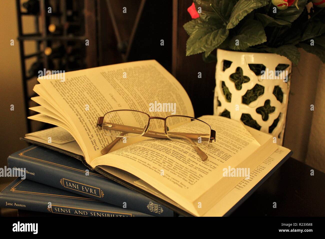 Dog eared Jane Austen with glasses Stock Photo