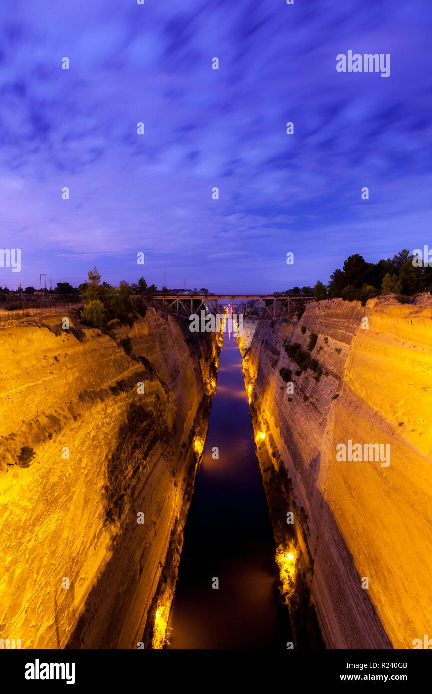 The Corinth Canal during midnight, Peloponnese, Greece. It separates Attica and Peloponnese, and connects Saronic and Corinthian gulfs. Stock Photo