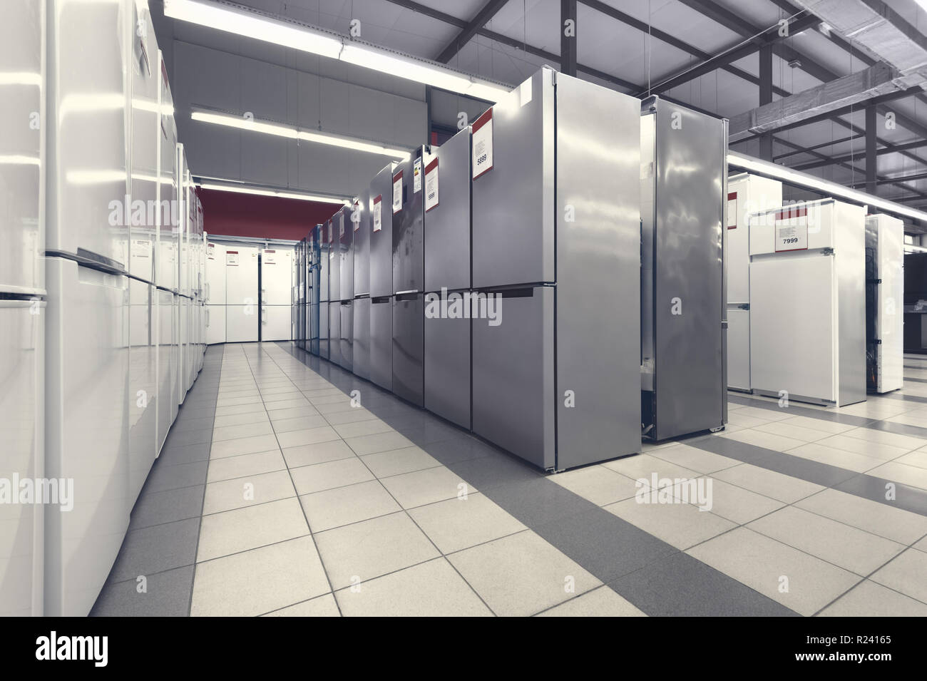 rows of refrigerators in appliance store Stock Photo