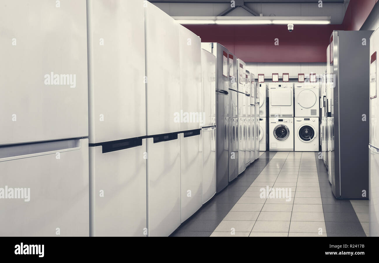 refrigerators and washing mashines in appliance store Stock Photo