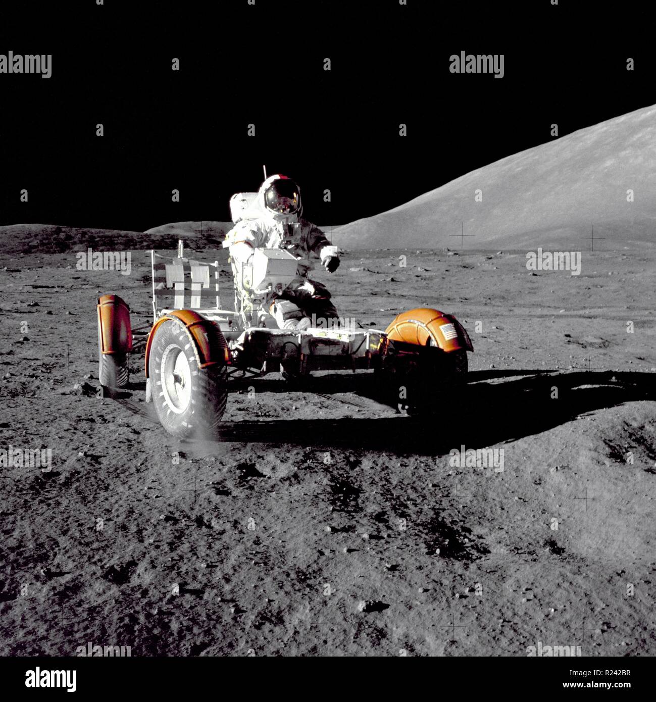 Apollo 17 commander Eugene Cernan test-drives the rover before it is loaded with gear to explore the lunar surface December 11, 1972 Stock Photo