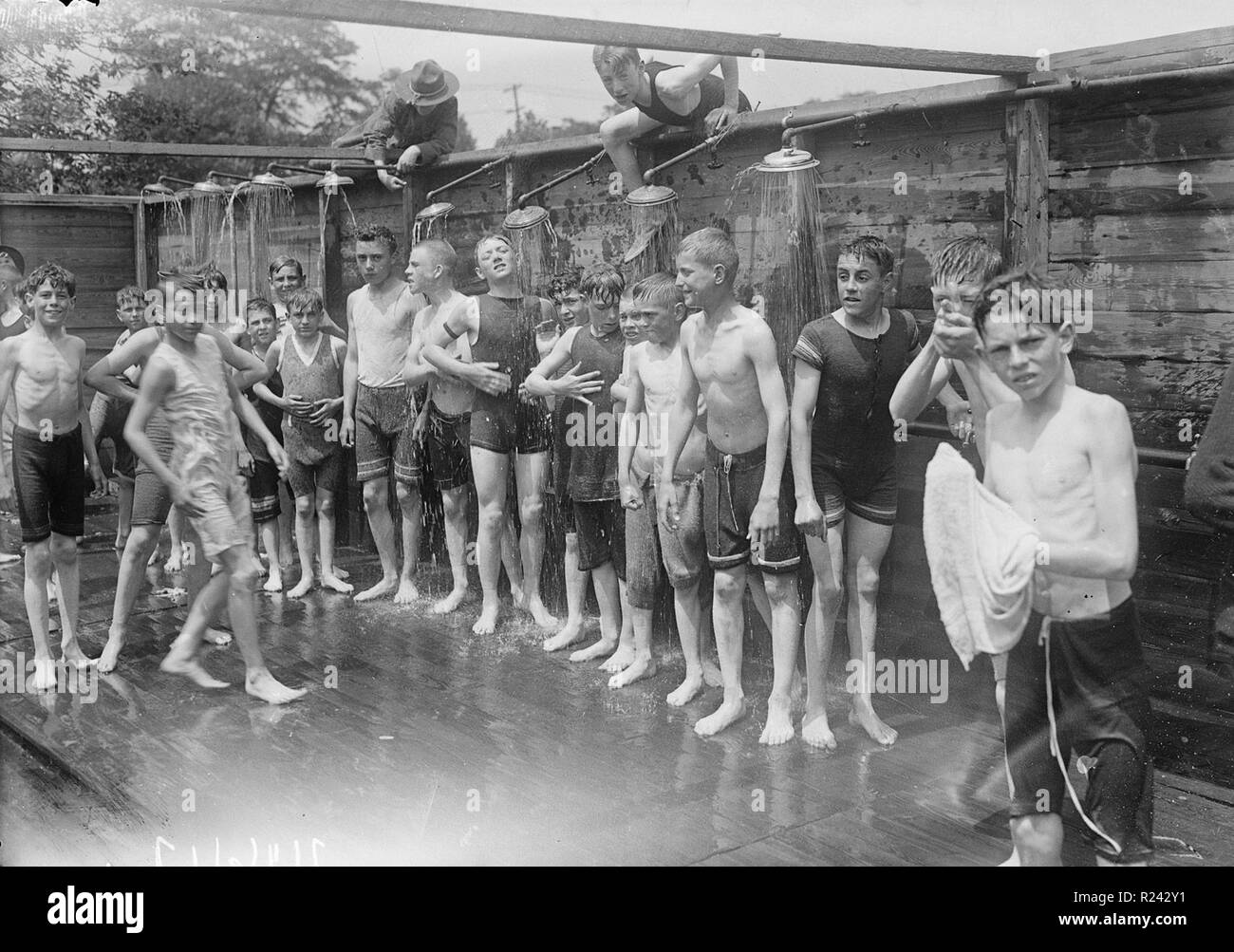 Boys shower at a public bathing facility, New York 1912 Stock Photo Alamy