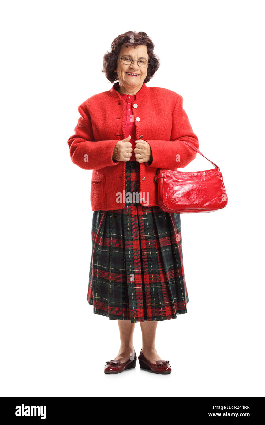 Full length portrait of an elderly woman with a red purse isolated on white background Stock Photo