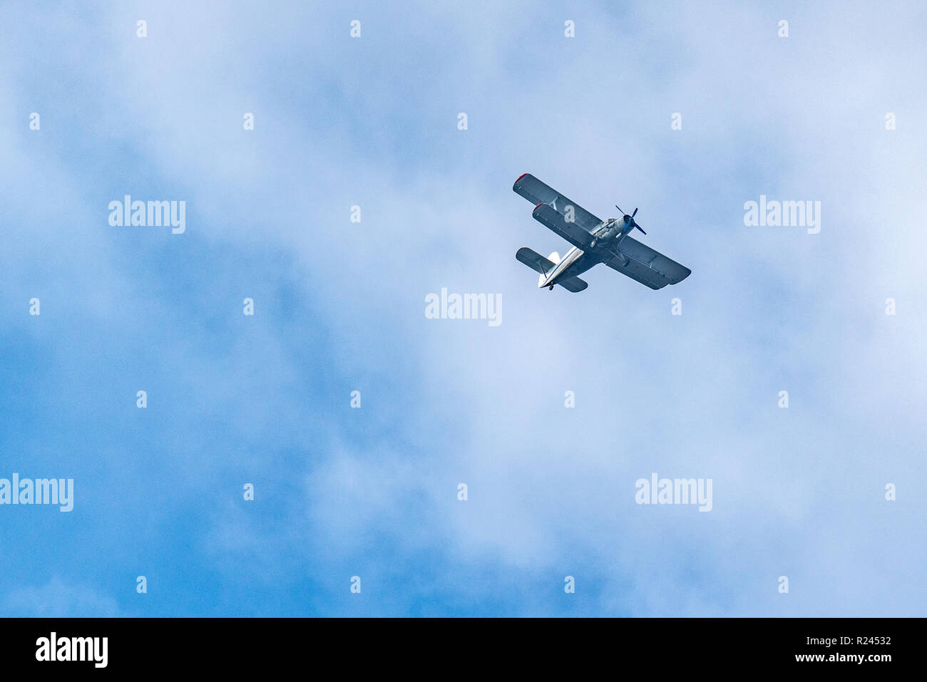 Old retro plane flies in the sky Stock Photo - Alamy