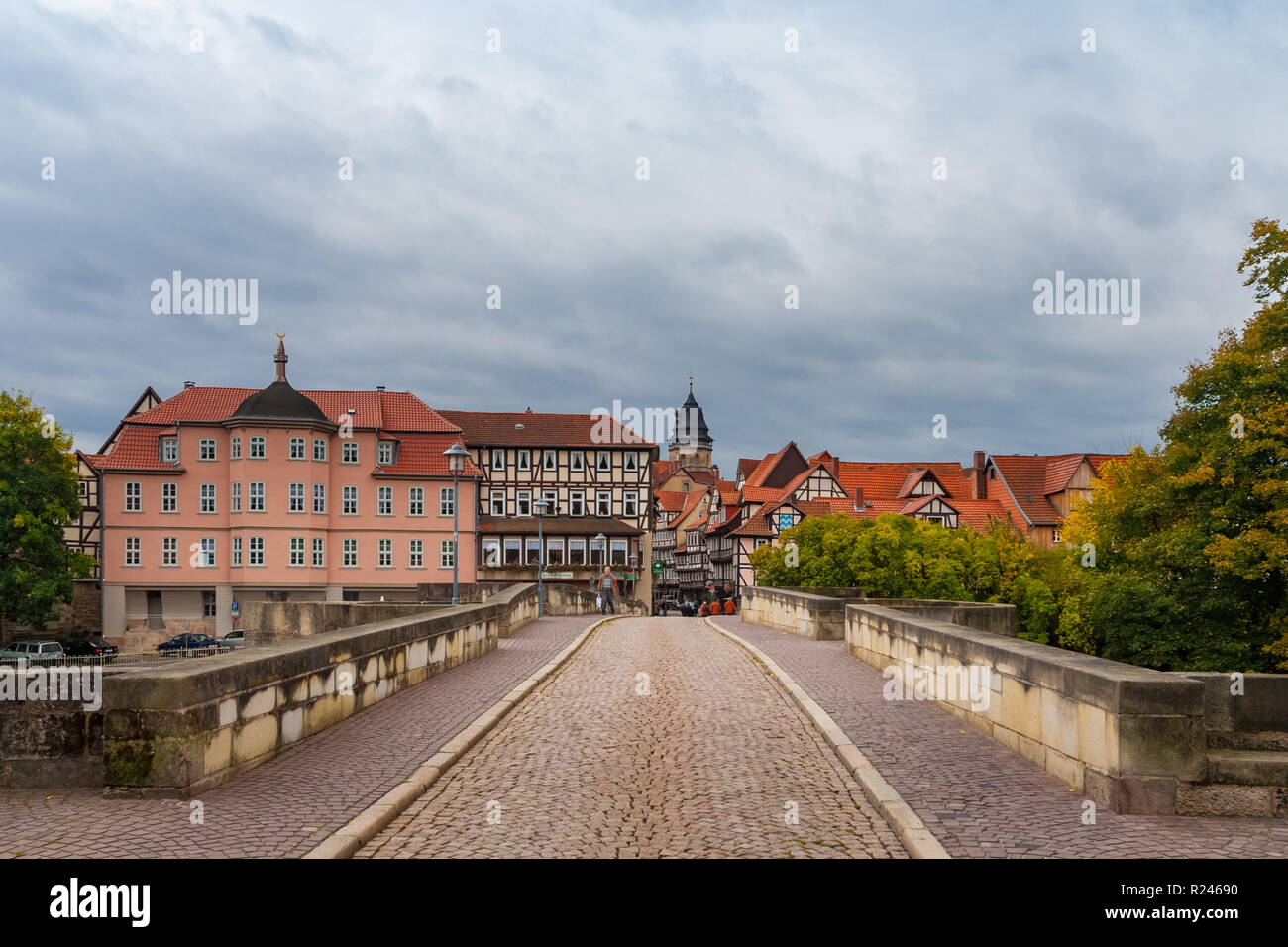 View of the old town of Hann. Münden with its half-timbered houses from the Old Werra Bridge paved with cobblestones. The building on the left is the... Stock Photo