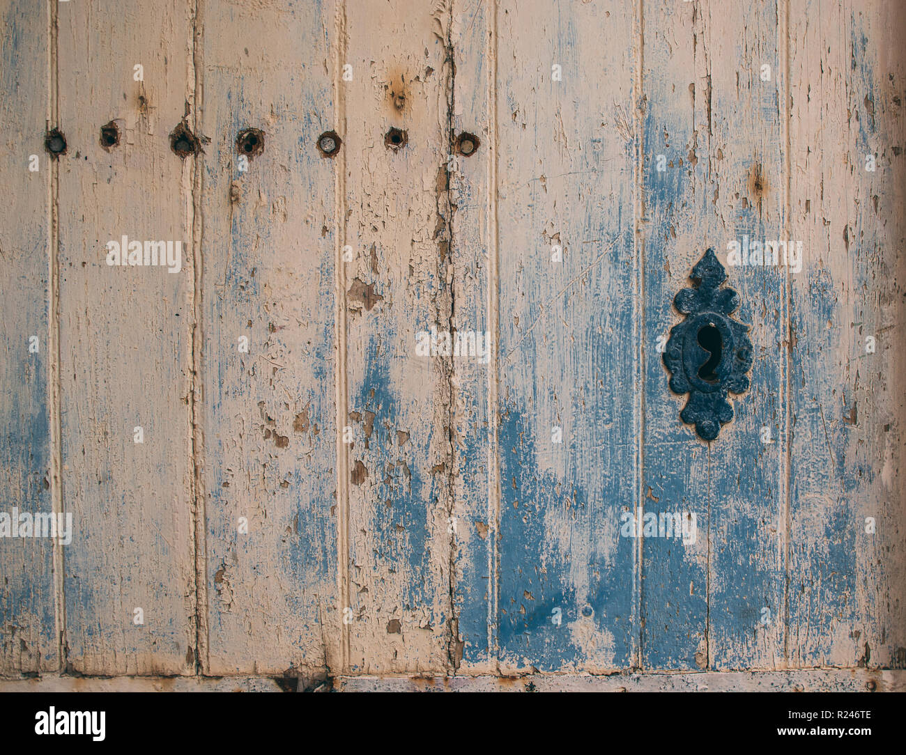 Old door with different paint, use as natural background Stock Photo
