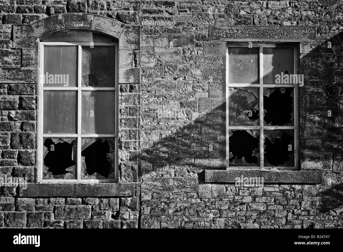 Broken windows at Brierfield, by the waterway of the Leeds to Liverpool Canal Stock Photo