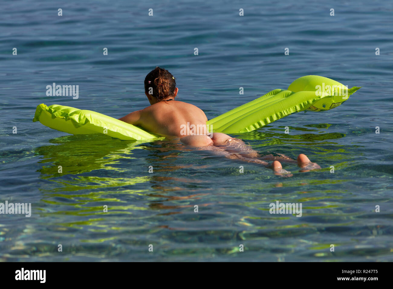 nudist gril Nudist girl on a floating matress Stock Photo - Alamy