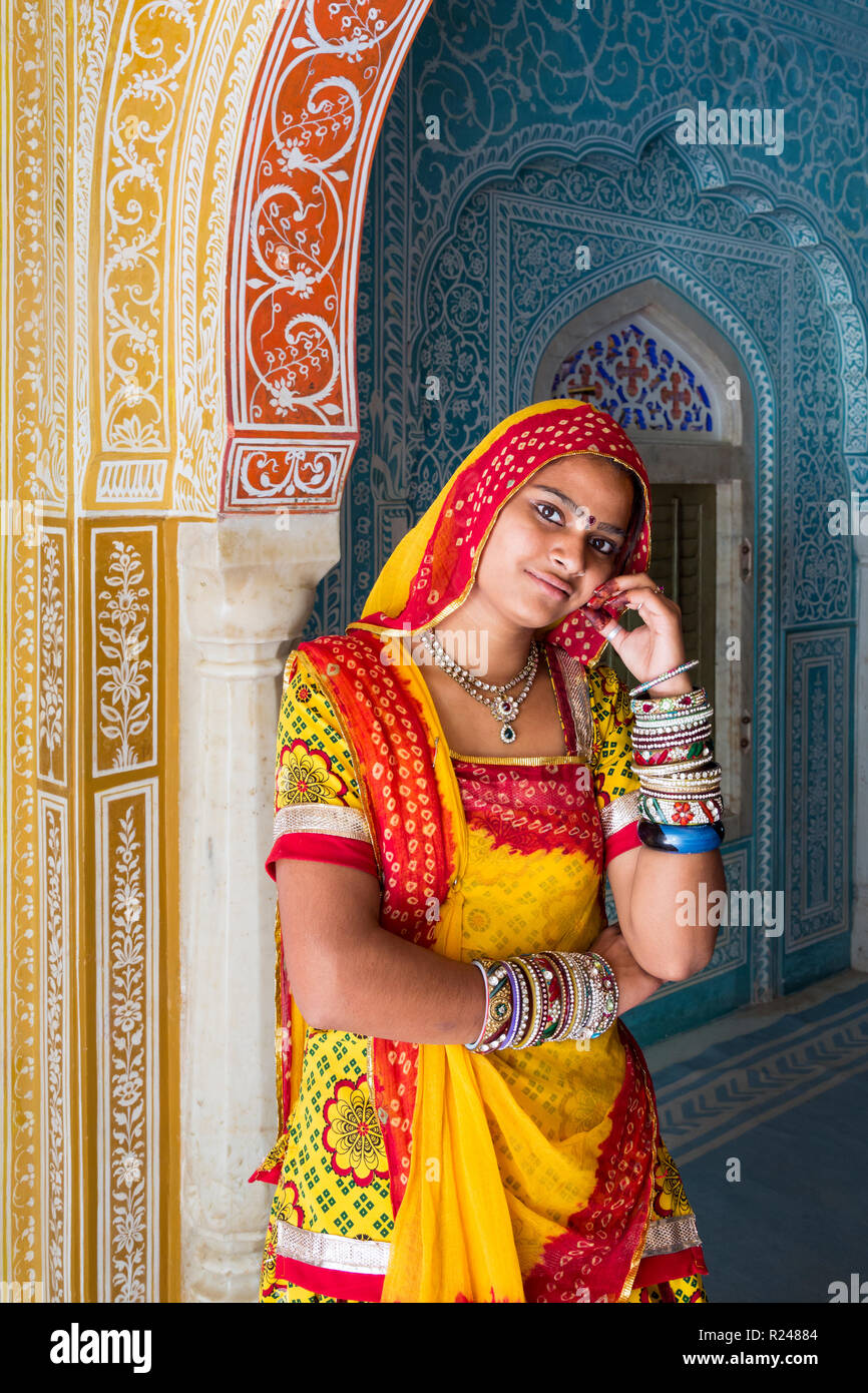 Lady wearing a colourful sari in ornate passageway, Samode Palace, Jaipur, Rajasthan, India, Asia Stock Photo