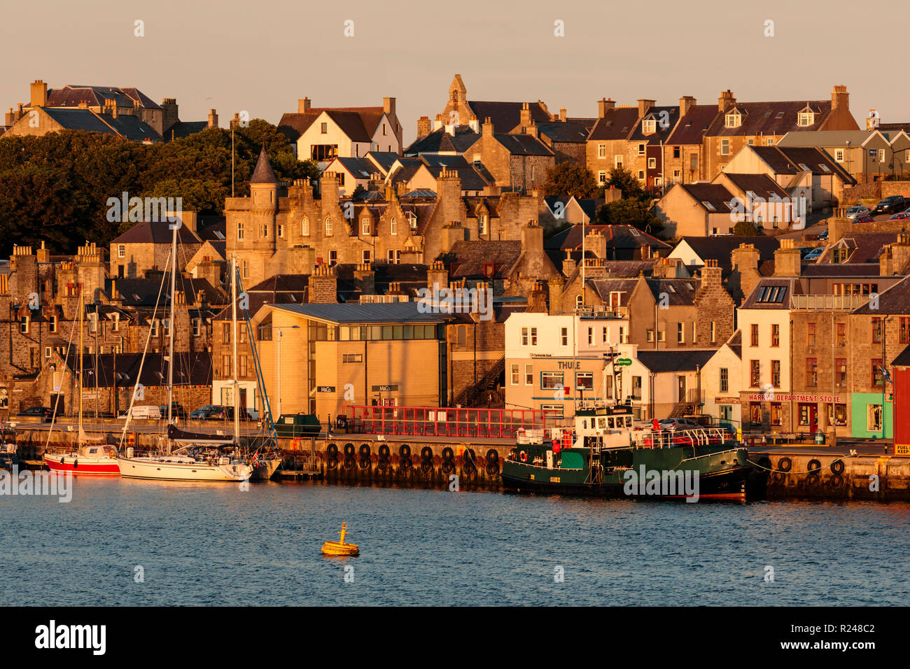 Lerwick, from the sea, waterfront sandstone buildings and golden early morning, Shetland Islands, Scotland, United Kingdom, Europe Stock Photo
