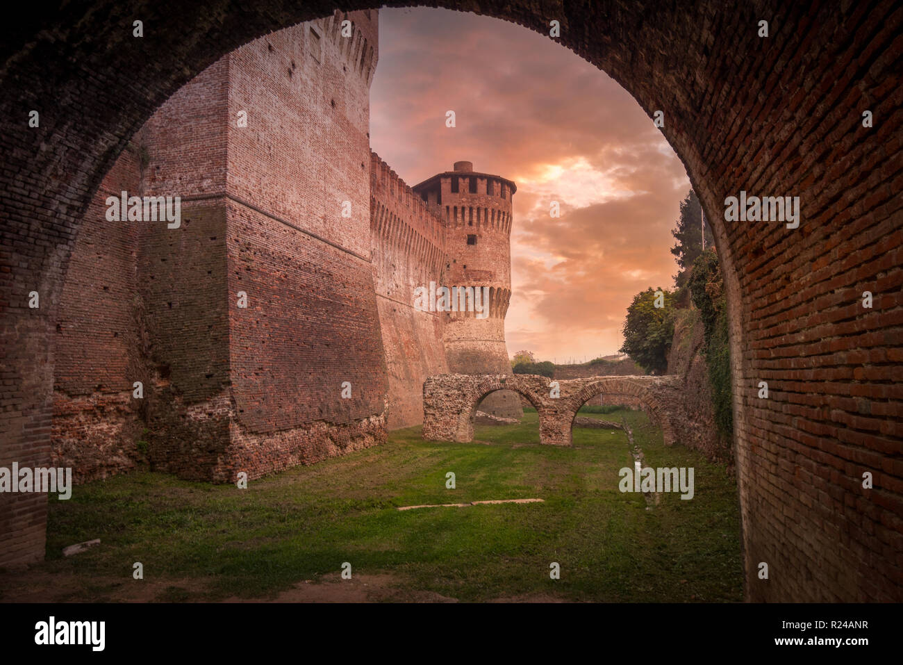 Aerial sunset view of medieval Soncino castle made of brick in Lombardia region in Italy with dramatic sky Stock Photo