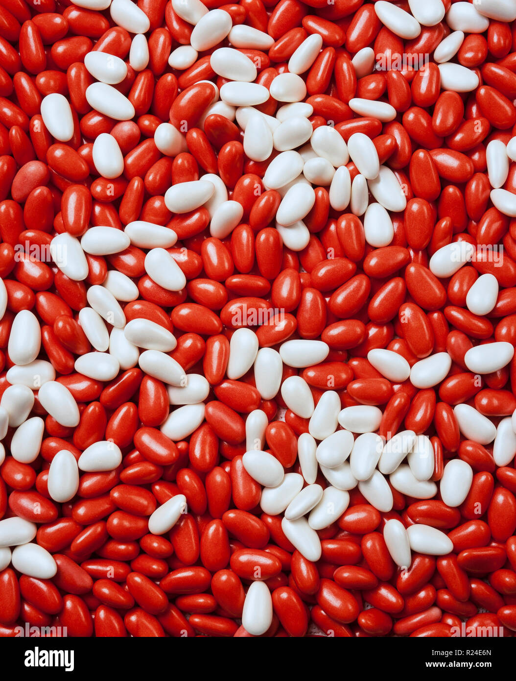Large group of red and white candycoated almonds still life Stock