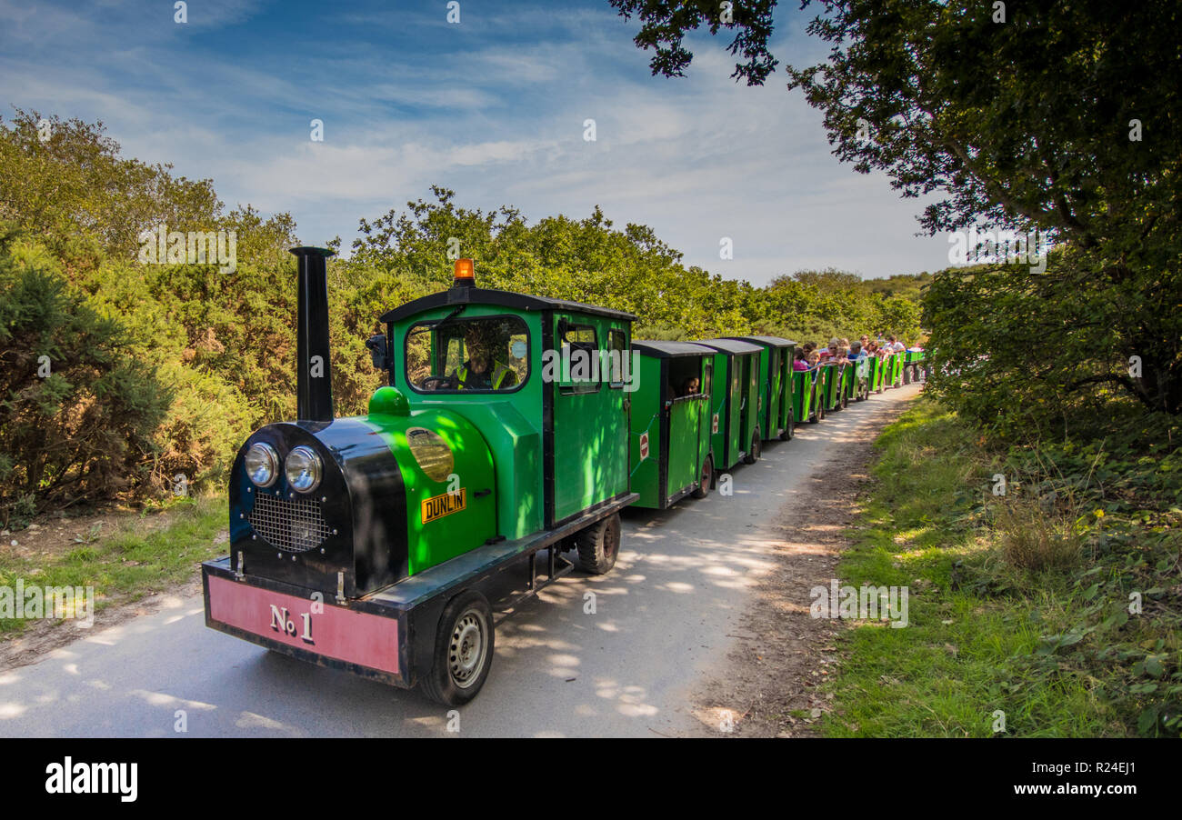 The land train driving along the public footpath at Hengistbury Head