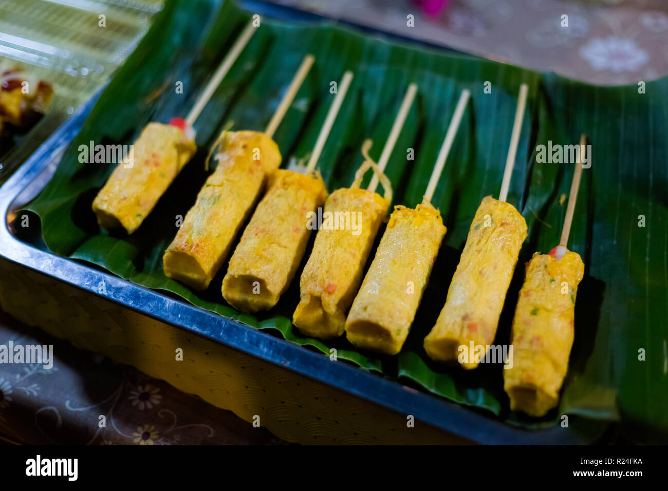 Fresh prepared asian fried egg omelette roll stick wit crabstick on local  market in Krabi. Traditional thai cuisine made of fresh ingredients Stock  Photo - Alamy
