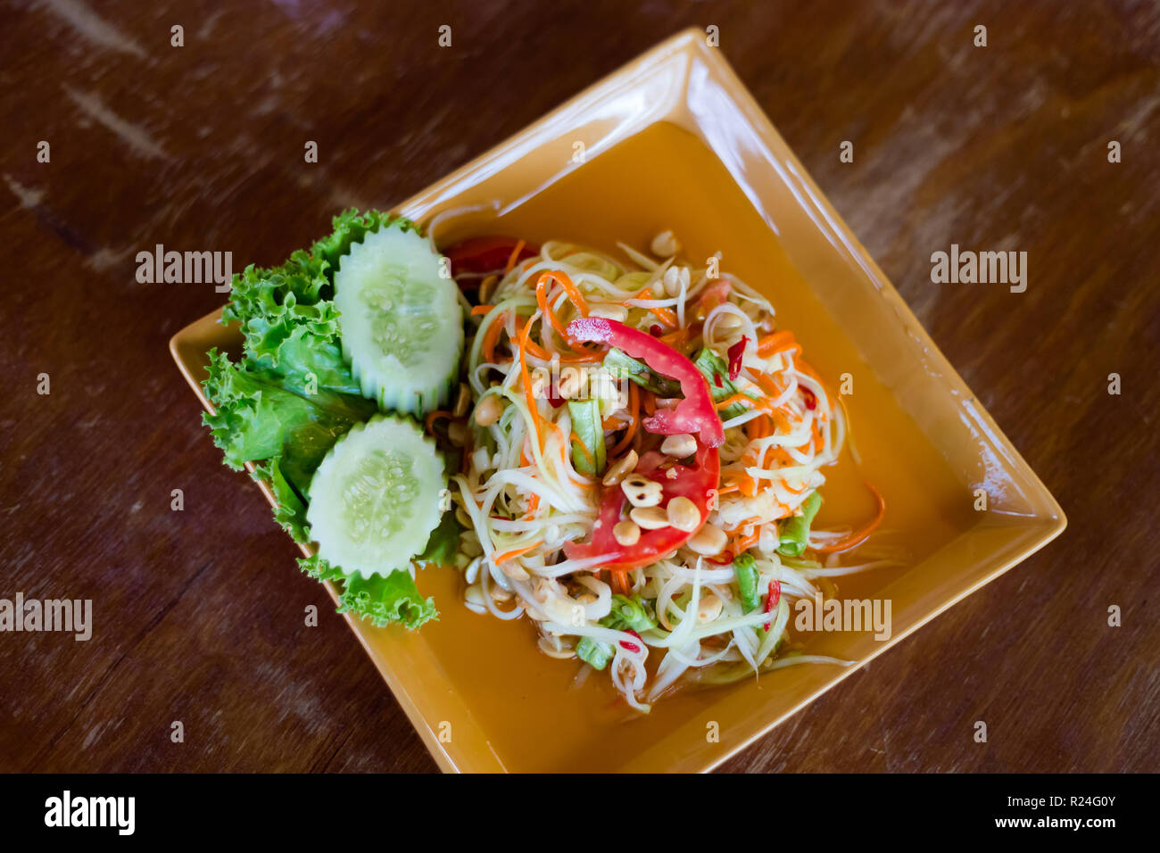 Fresh prepared asian spicy Som Tam papaya salad in local restaurant on Koh Lanta island