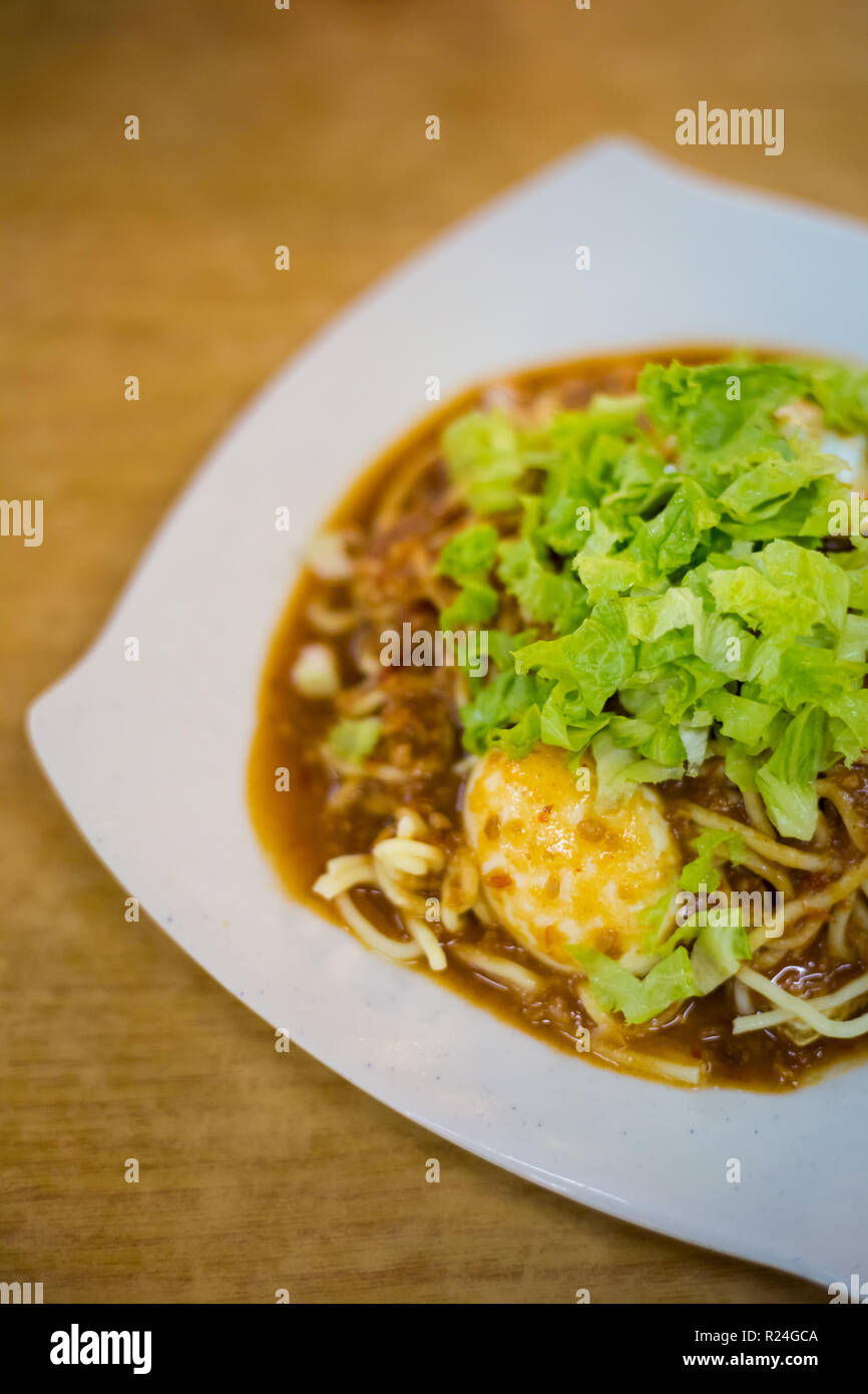 Fresh prepared malaysian Mee Rojak fried noodles with vegetables in ...