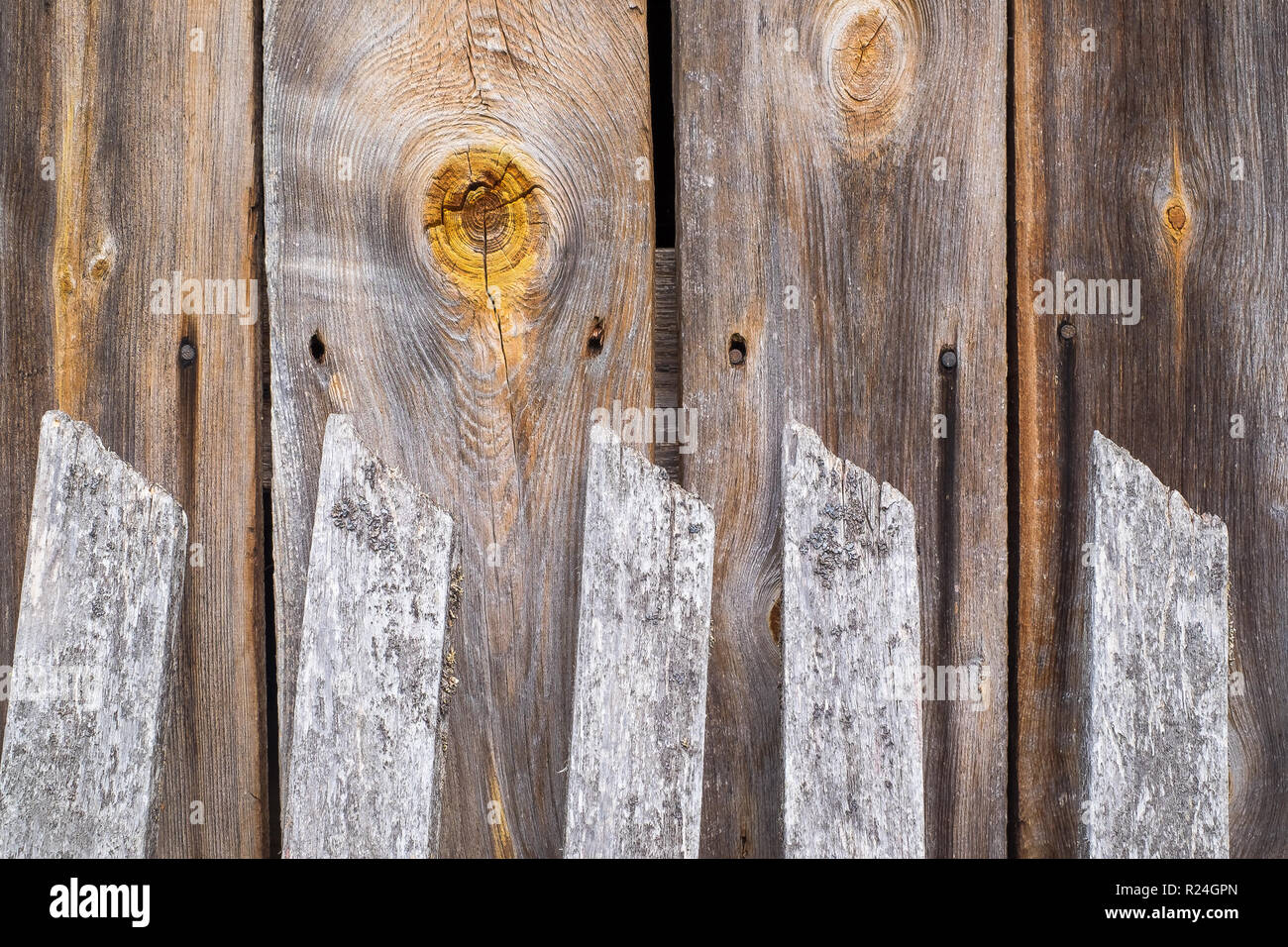 wooden fence, knot and country house wall Stock Photo