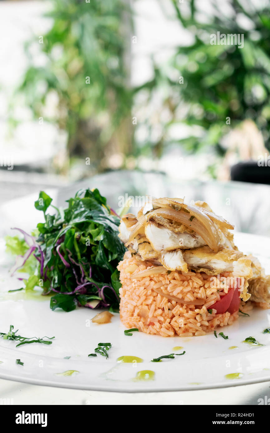 Portuguese fish in Escabeche sauce with tomato rice traditional gourmet
